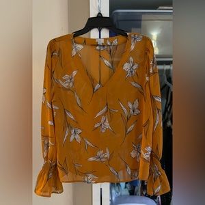 Large “A New Day” orange floral blouse with frill sleeves